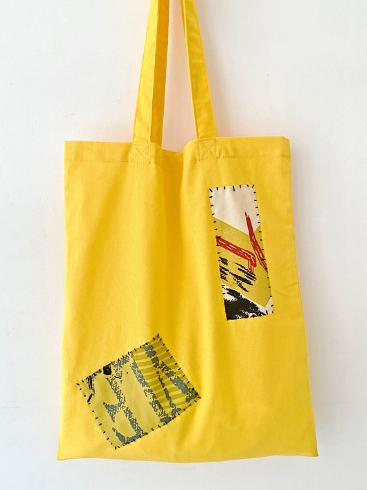 Eco-friendly canvas tote with handmade embroidery, ideal for fans of handmade designs