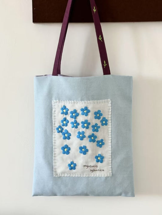 Patchwork embroidered canvas bag with colorful stitched details