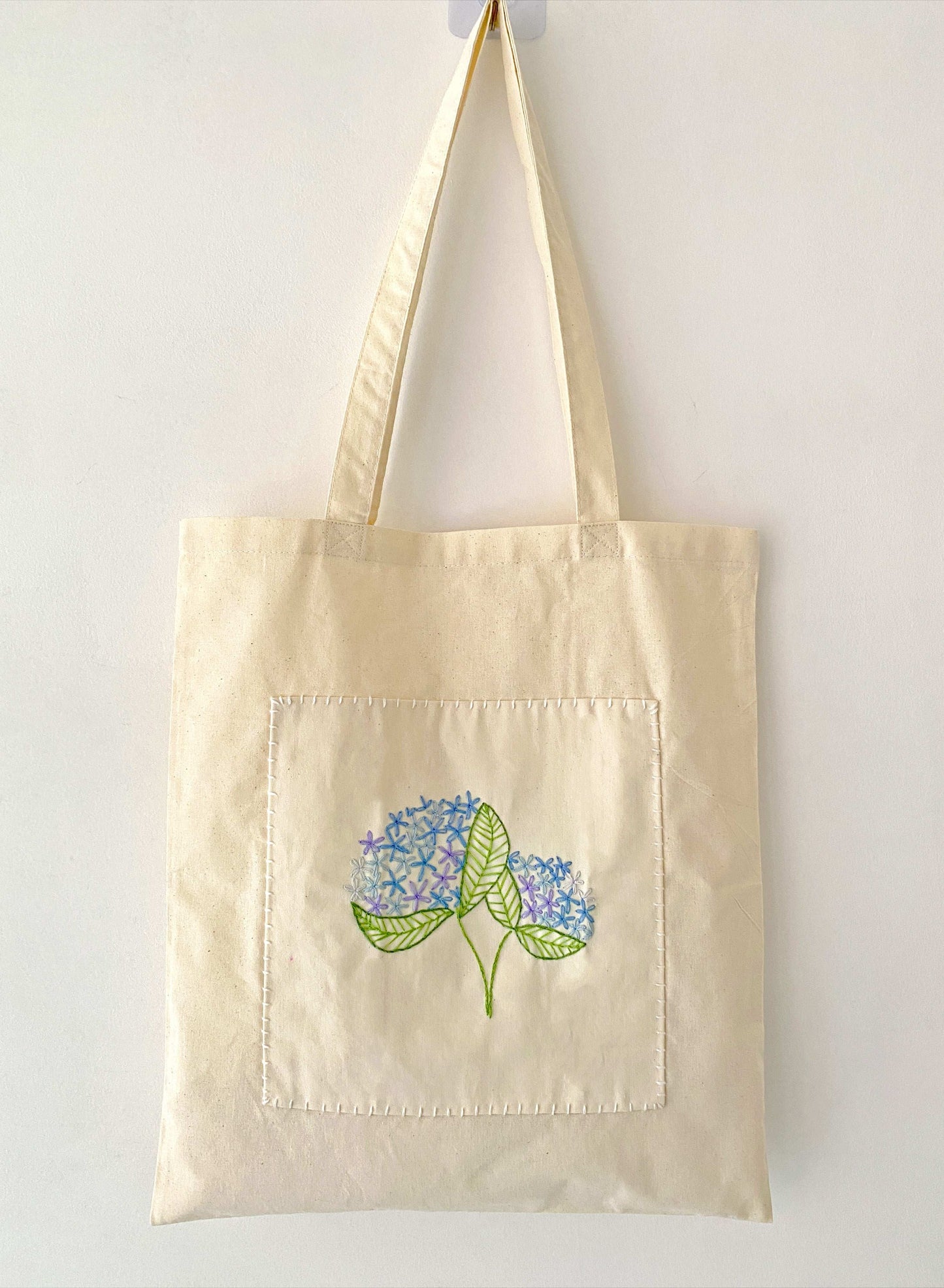 Organic cotton canvas tote with handcrafted floral details for stylish women