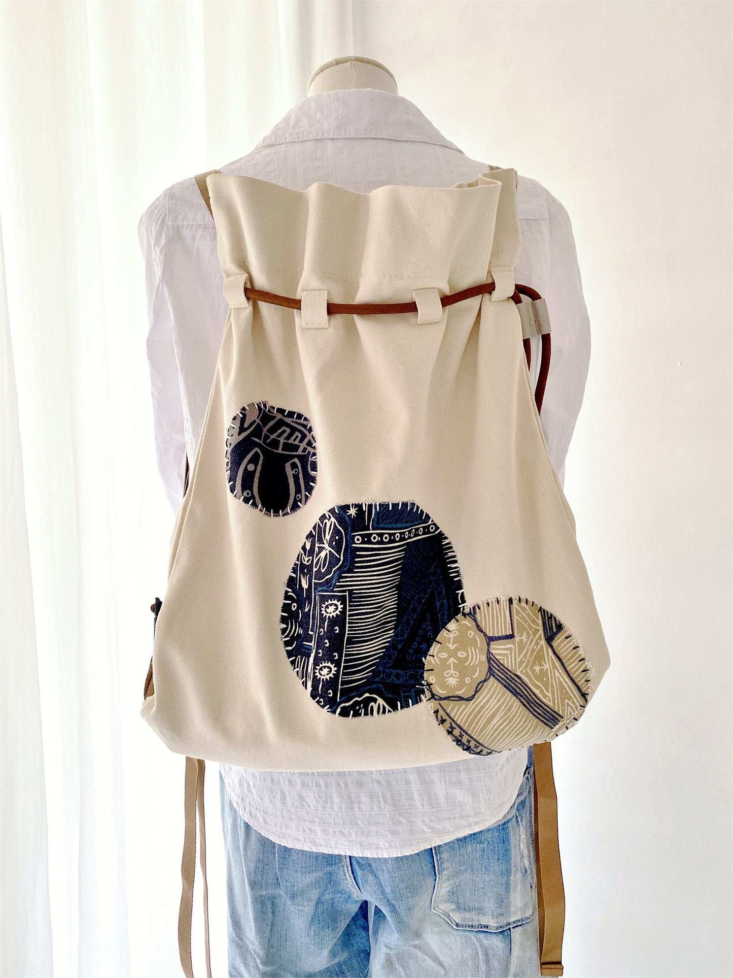 sustainable fashion fabric backpack with personalized quilted design