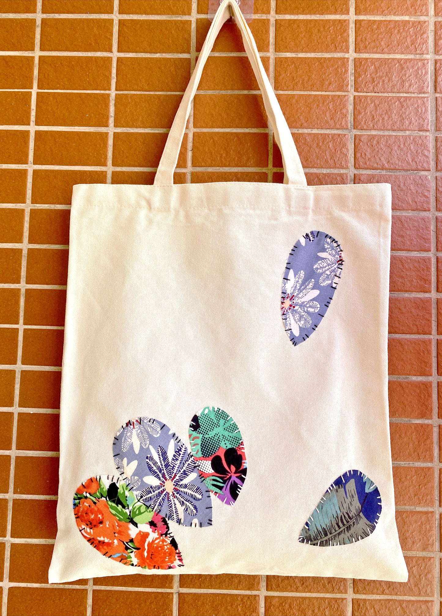 Long-lasting handmade tote bag with artistic patchwork details