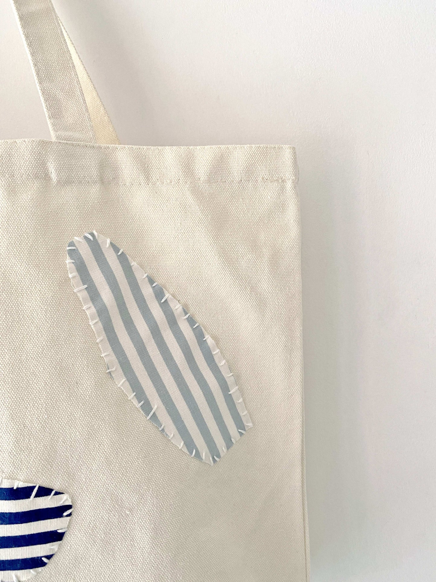 hand crafted durable canvas bag with artistic fabric stitching