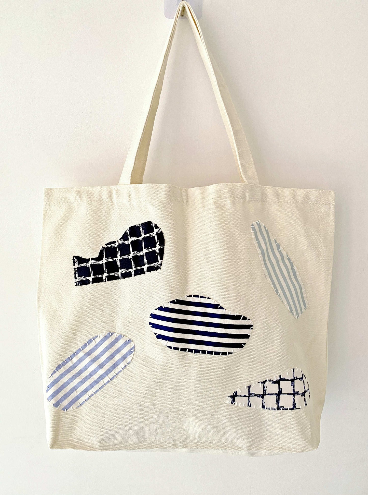 sustainable slow fashion shoulder bag with creative fabric patchwork