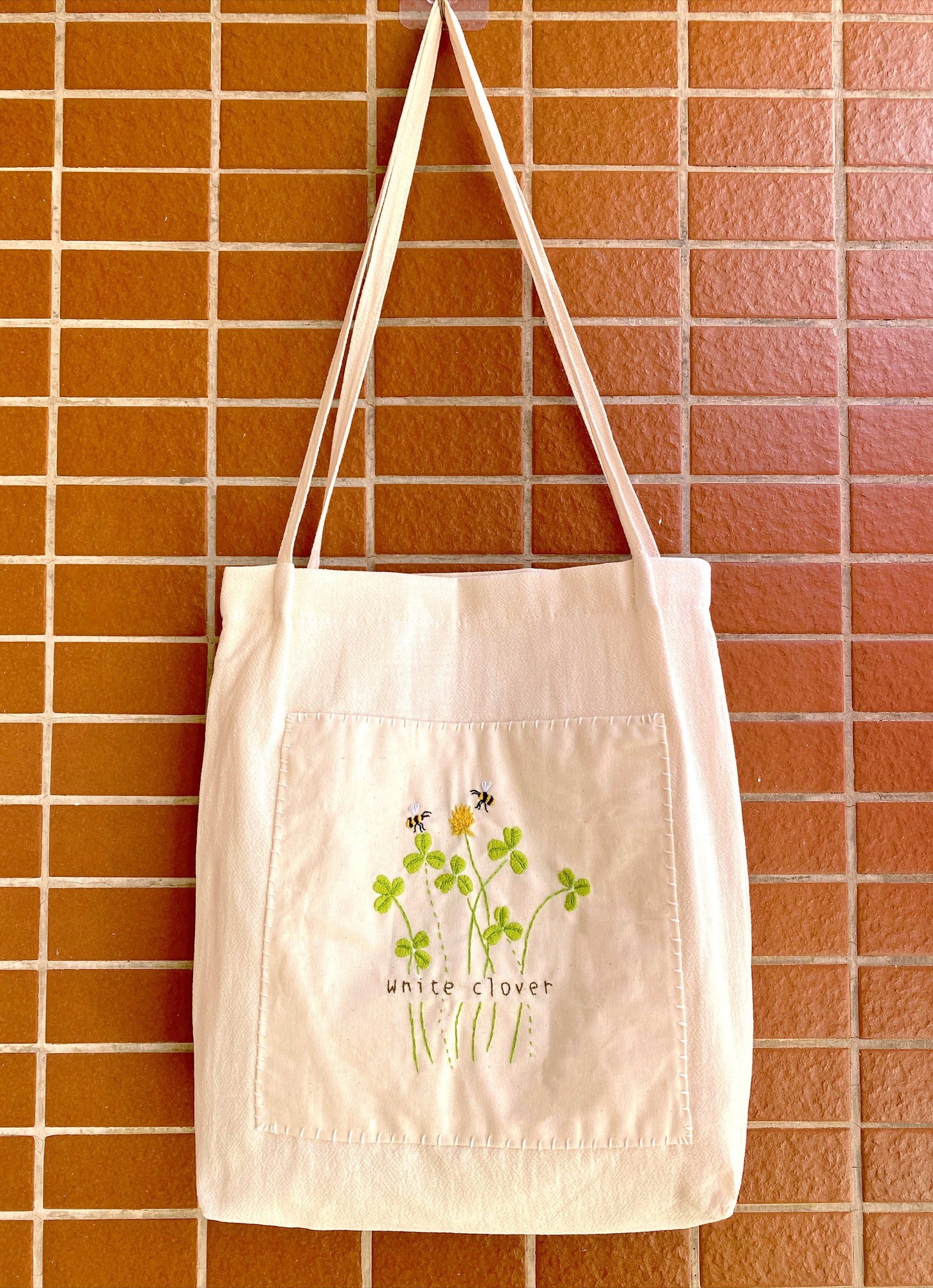 Luxury handmade linen purse with embroidered botanical patterns