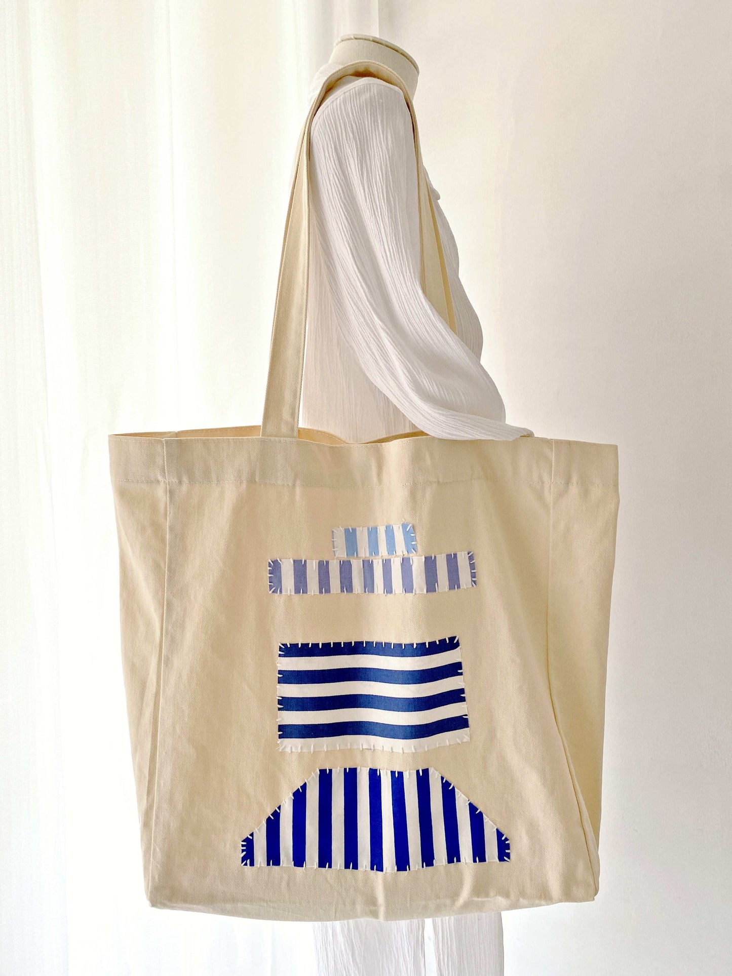 Eco-friendly durable cotton tote with DIY patchwork art for daily use