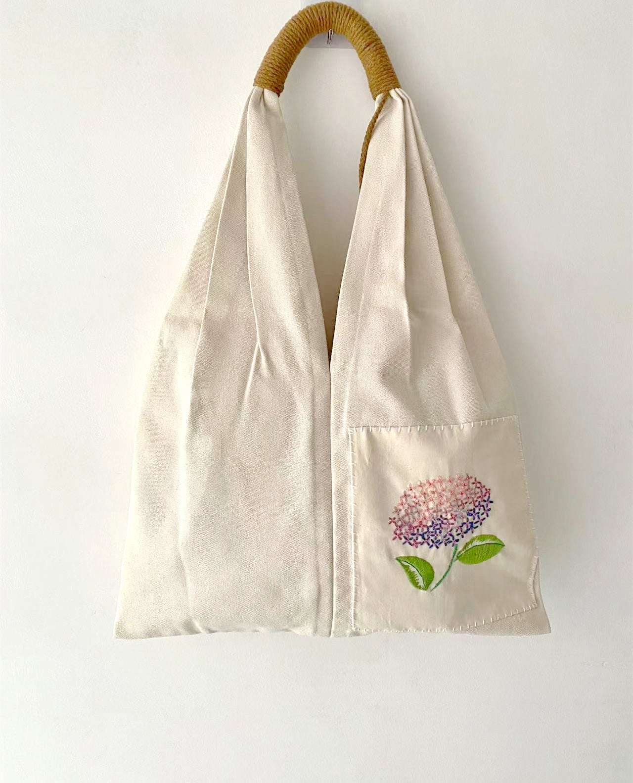Handmade embroidered flower pattern on organic canvas tote
