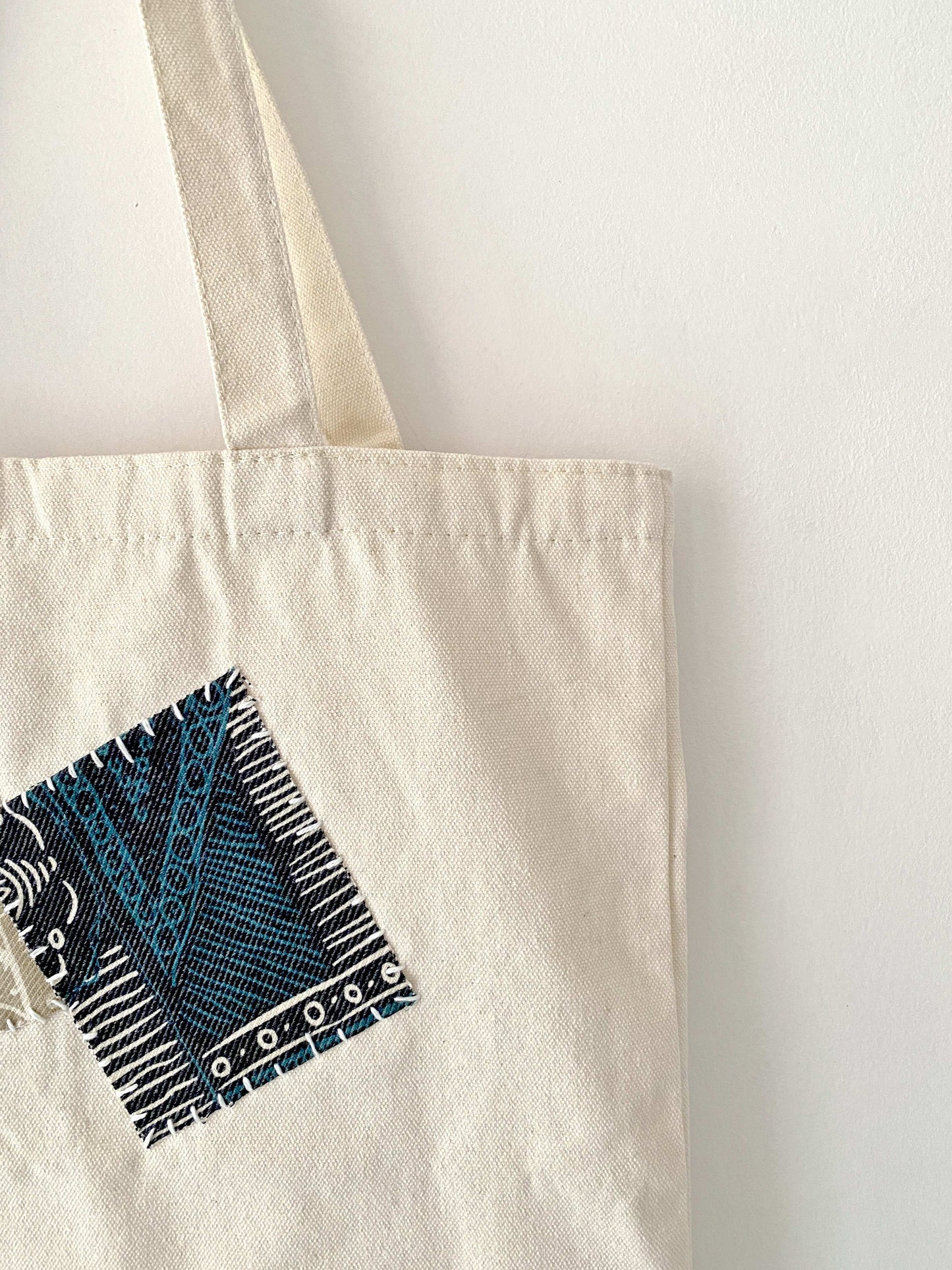 Reusable eco bag with hand-stitched design
