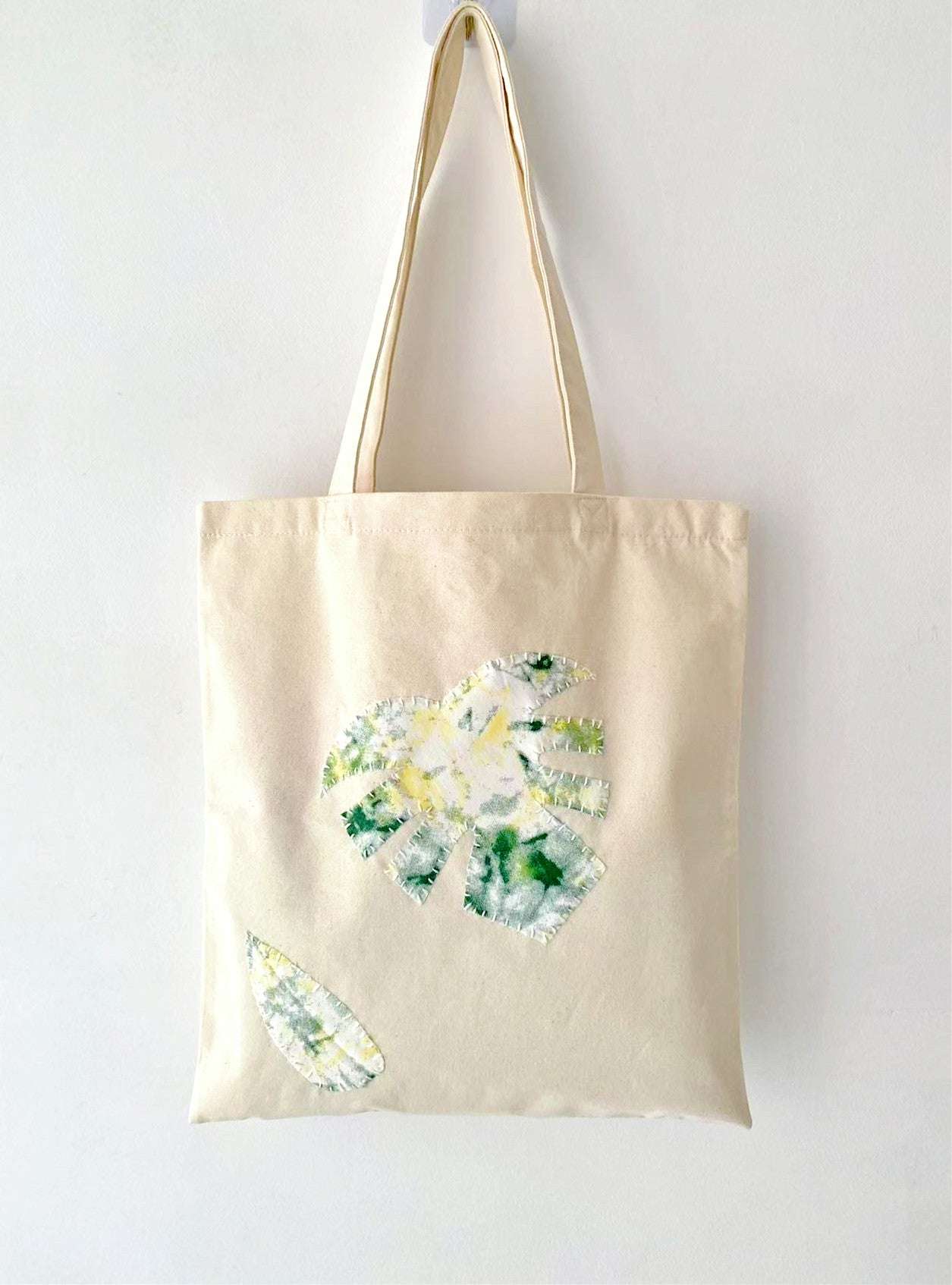 Natural cotton tote with green leaf stitch