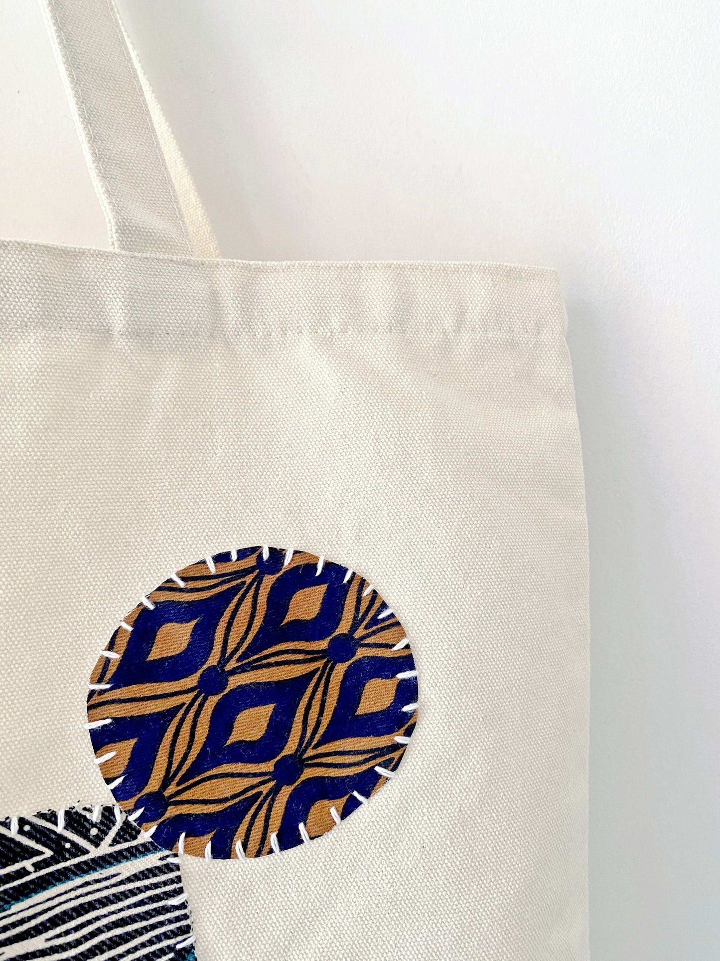 Elegant sustainable cotton tote bag with creative patchwork accents