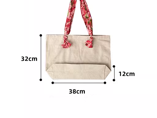 Hand-stitched design on organic linen bag