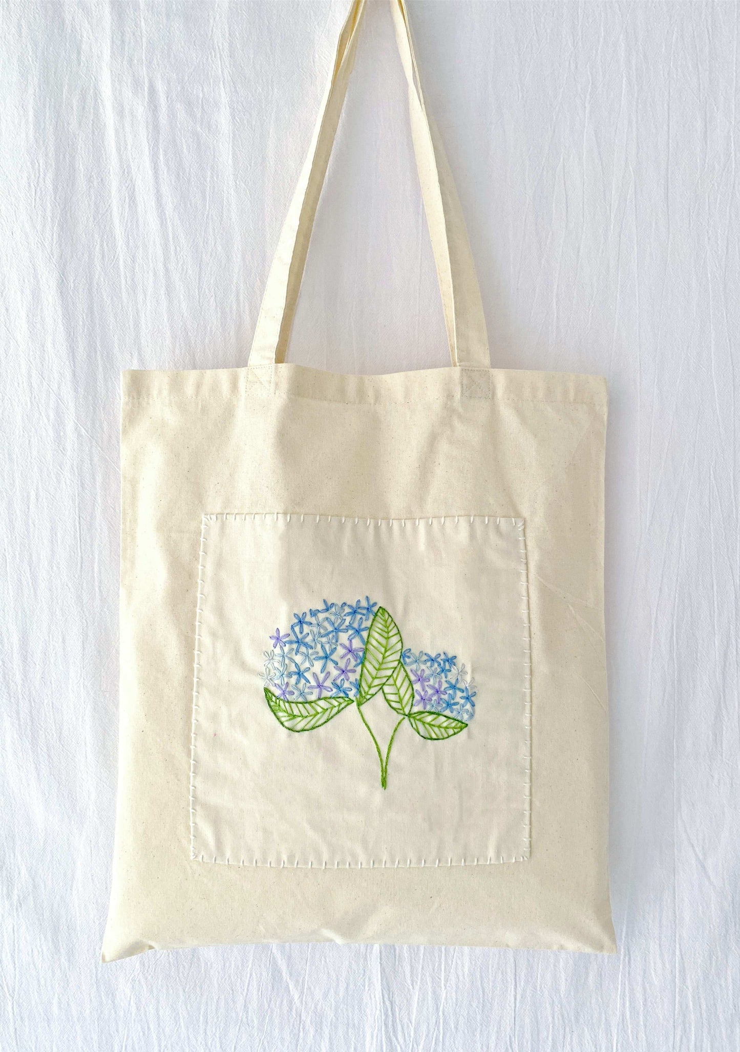 Stylish slow-fashion tote with artisanal embroidered flowers