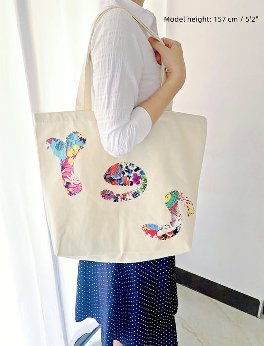 Durable eco canvas tote with hand-sewn patchwork for daily essentials