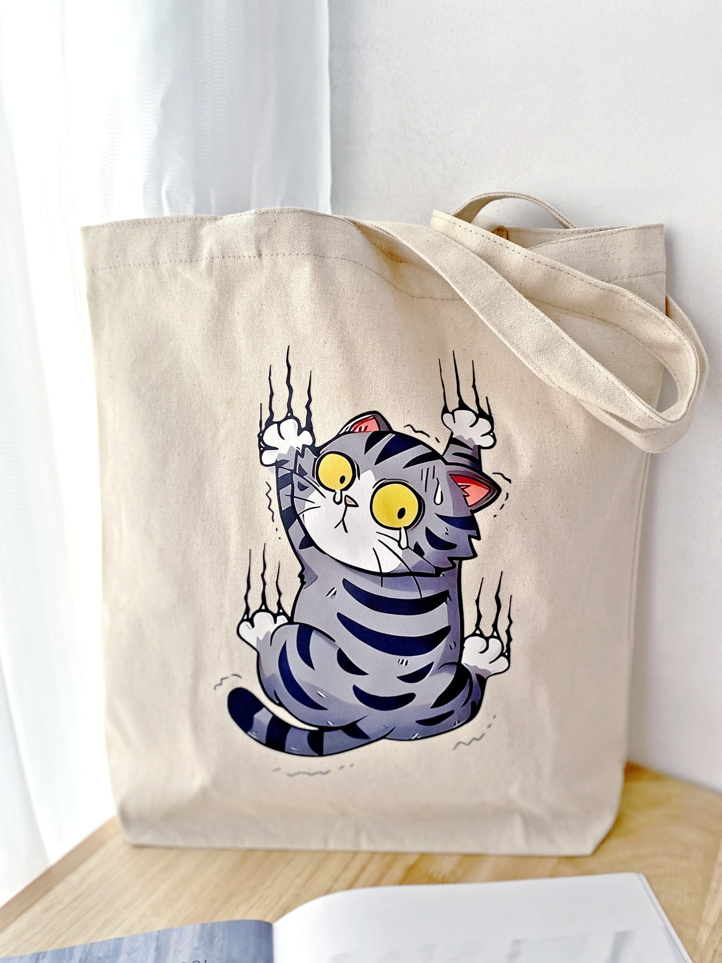sustainable natural material shoulder bag with unique cat design, perfect graduation gift
