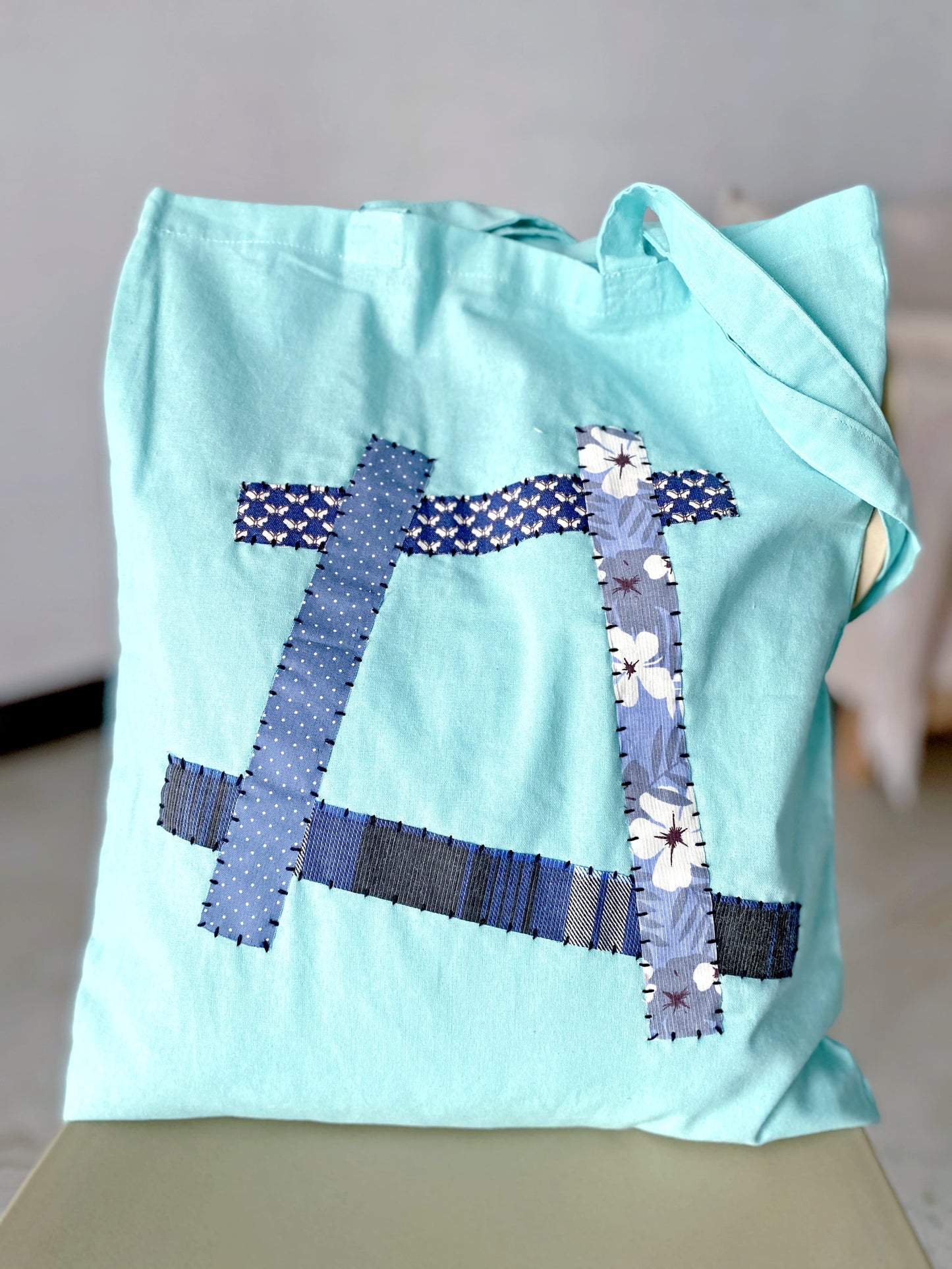 Minimalist soft fabric shoulder bag with sustainable natural materials and creative patchwork