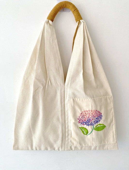 Eco-friendly canvas shoulder bag with handmade floral embroidery