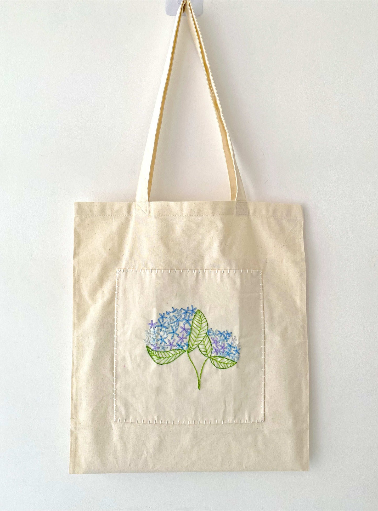 Lightweight embroidered shoulder bag in minimal style