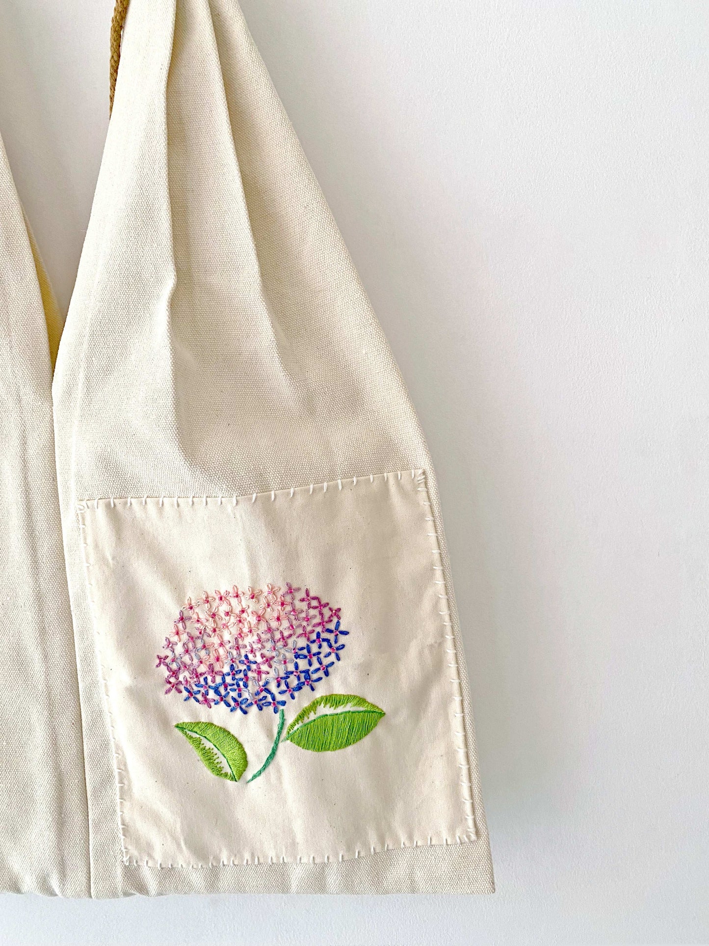 Floral embroidery close-up on natural canvas