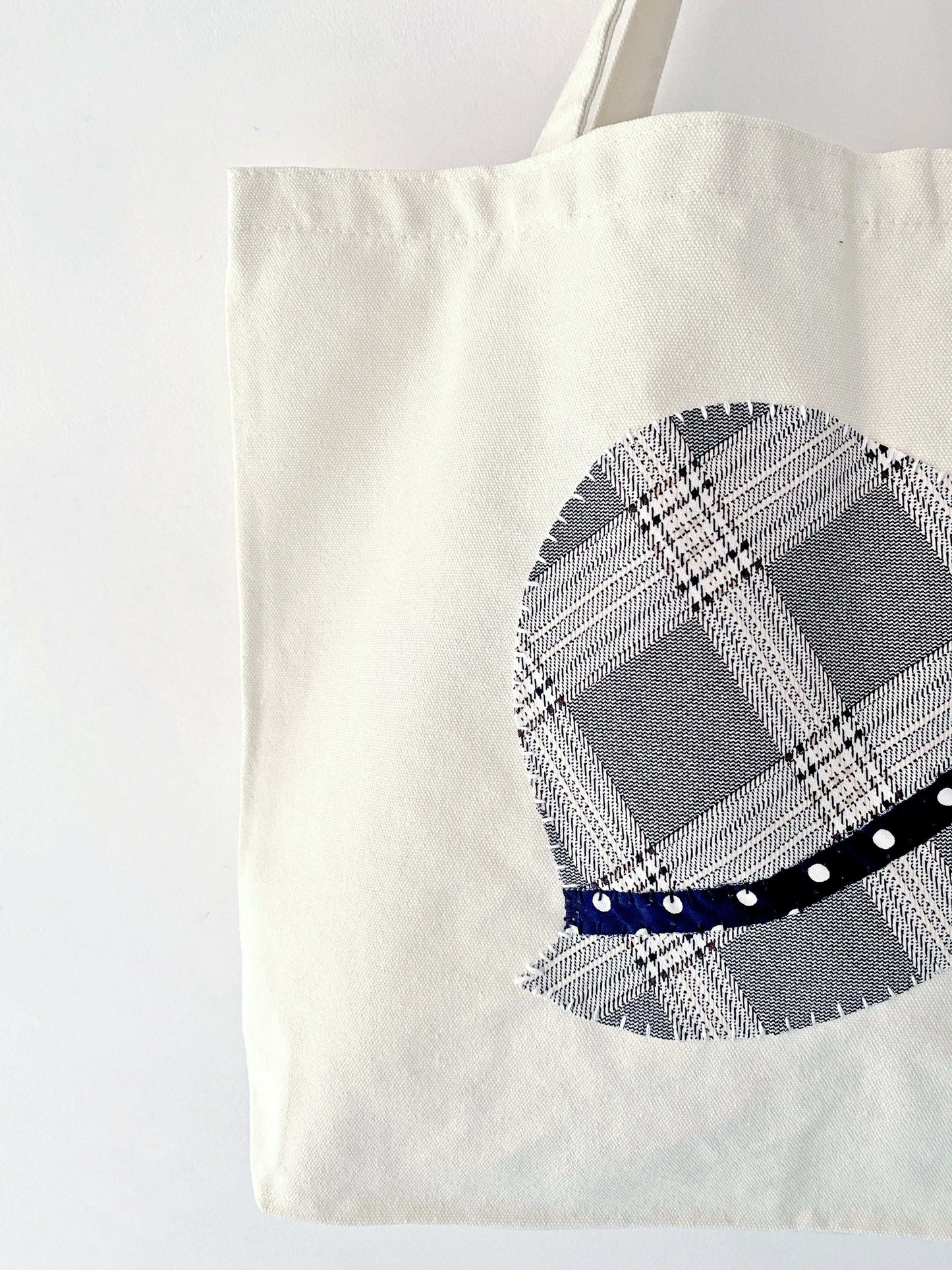 Stylish tote bag with hand-stitched patchwork crafted from natural materials