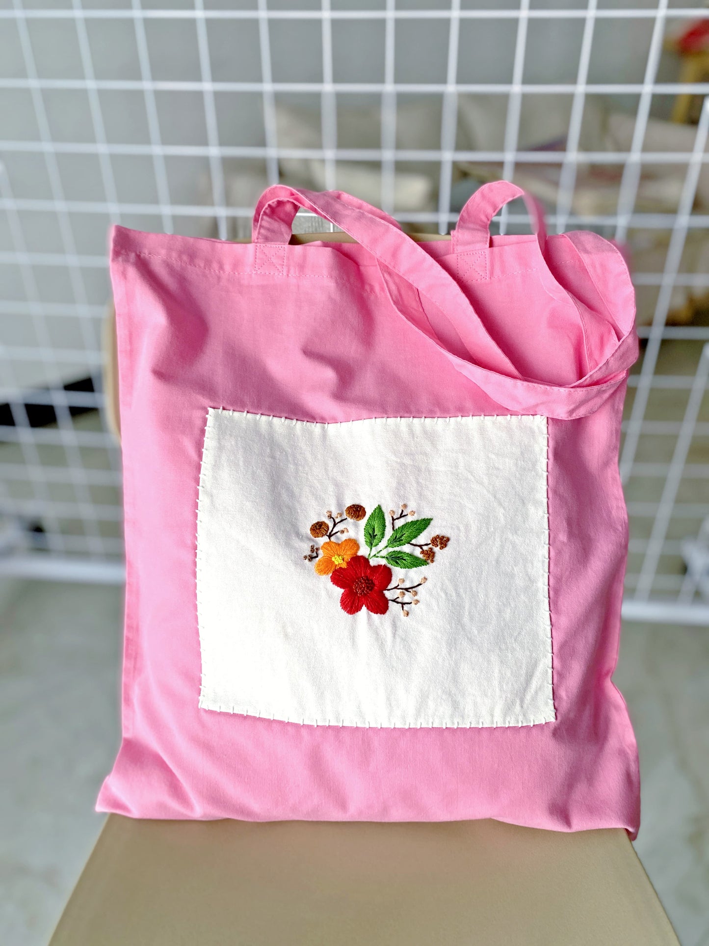 sustainable cotton shoulder bag featuring handmade flower embroidery