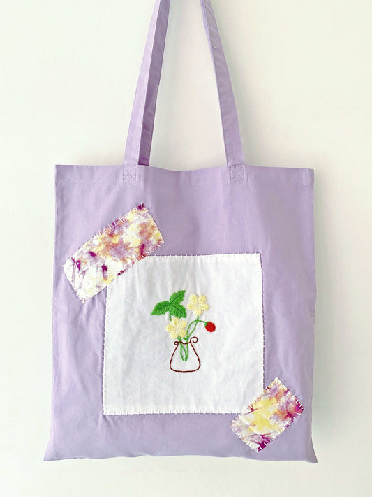 Artisan cotton tote decorated with delicate embroidery art