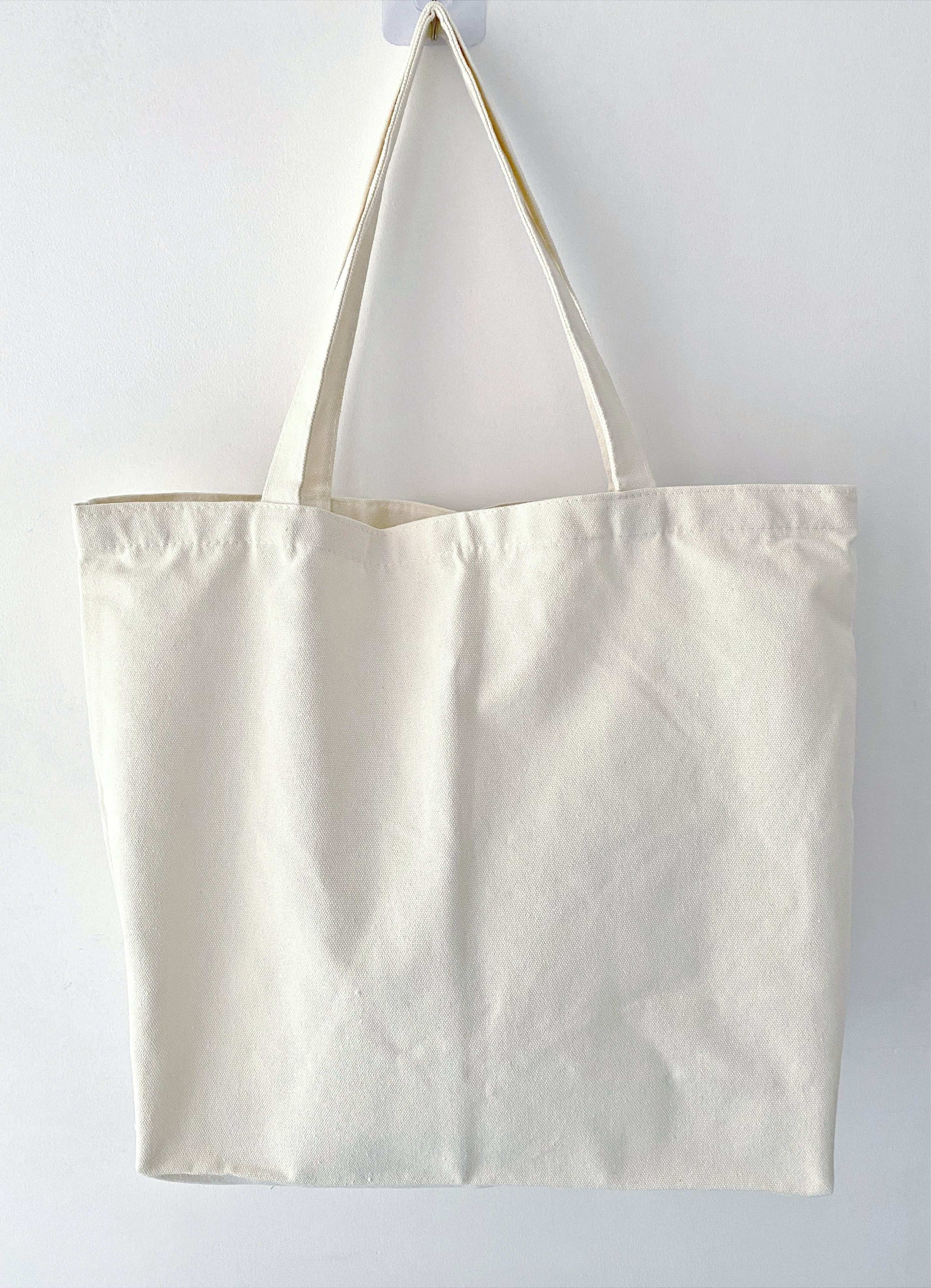 Minimalist tote crafted from eco cotton canvas with artisanal stitchwork