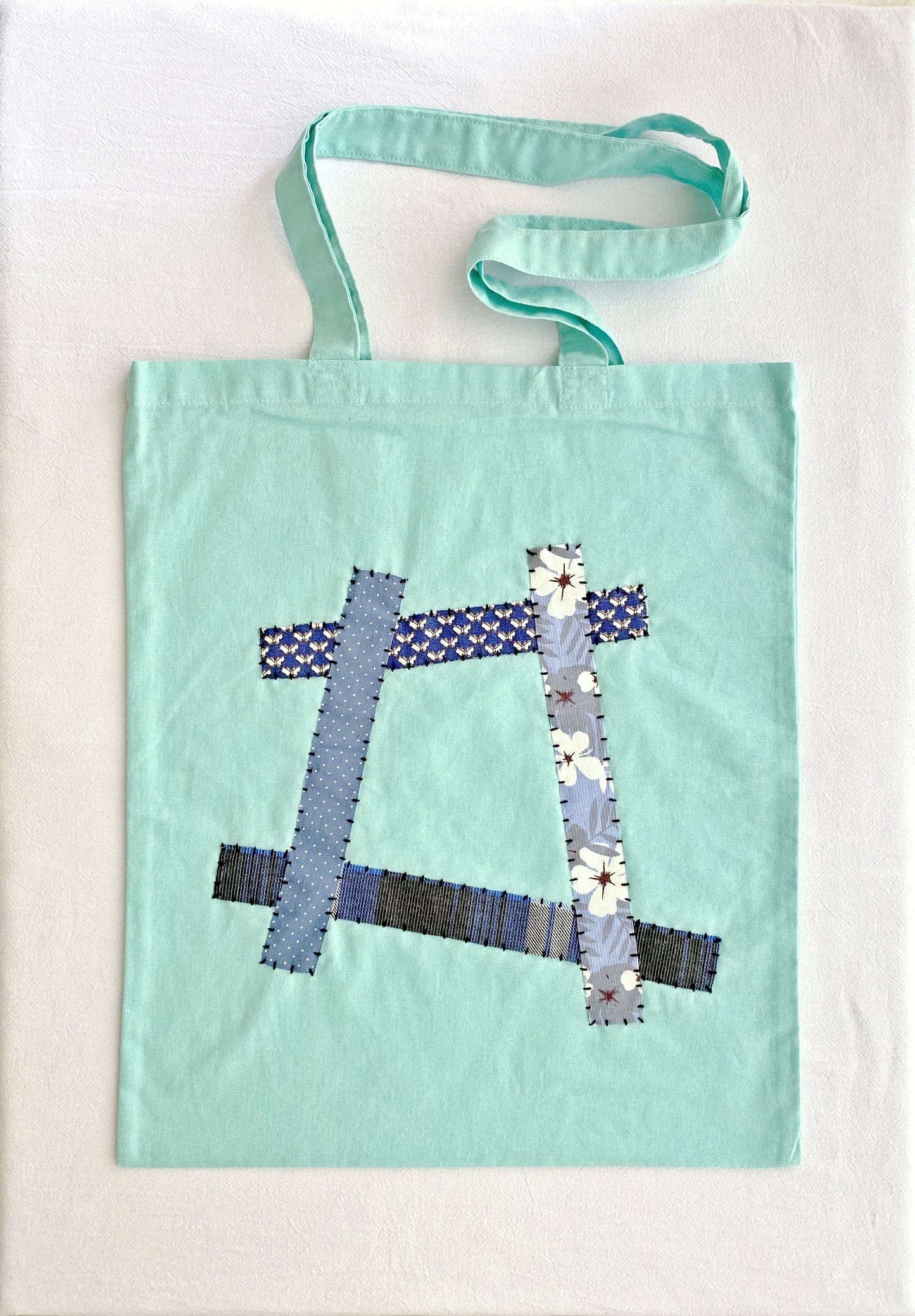 lightweight cotton tote bag with hand stitched patchwork design