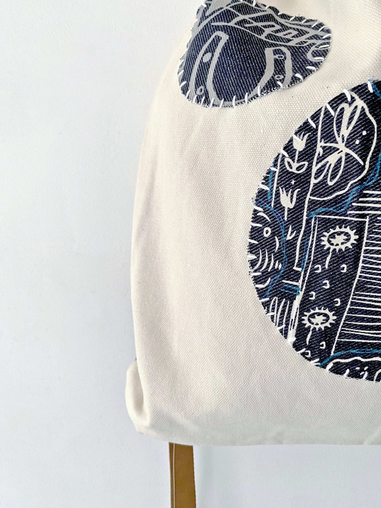 women’s sustainable canvas backpack with artistic patchwork design