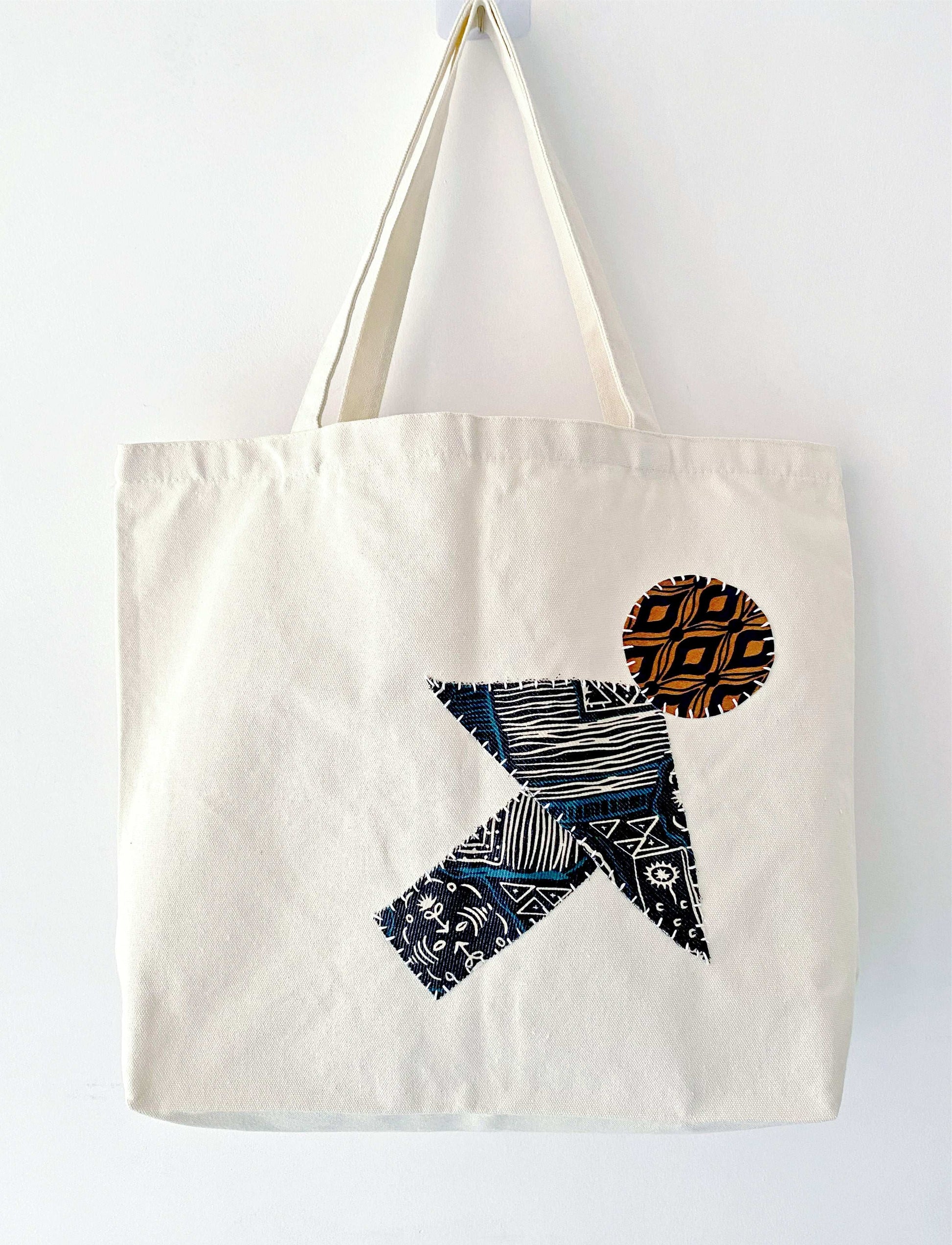 Spacious everyday canvas tote with artisanal patchwork accents