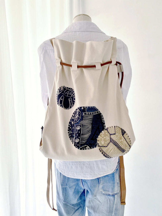 stylish sustainable canvas backpack with artisan patchwork details