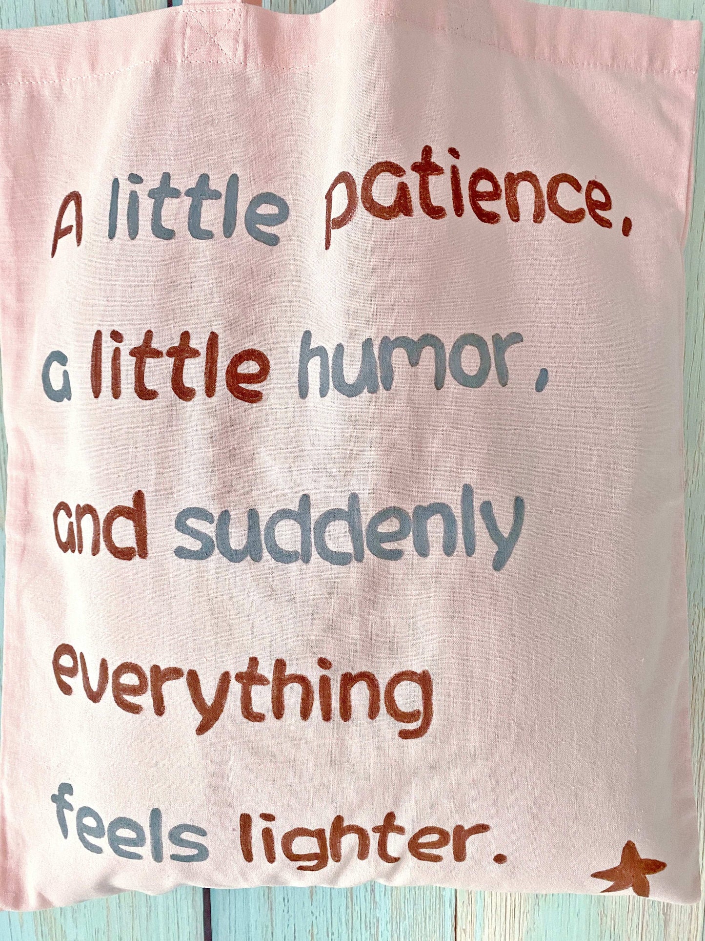 Gentle pink fabric tote with breathable natural fibers and a simple handwritten detail