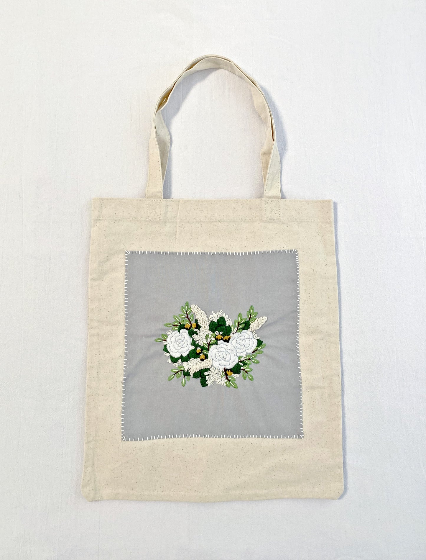 Minimalist cotton shoulder bag with unique floral embroidery