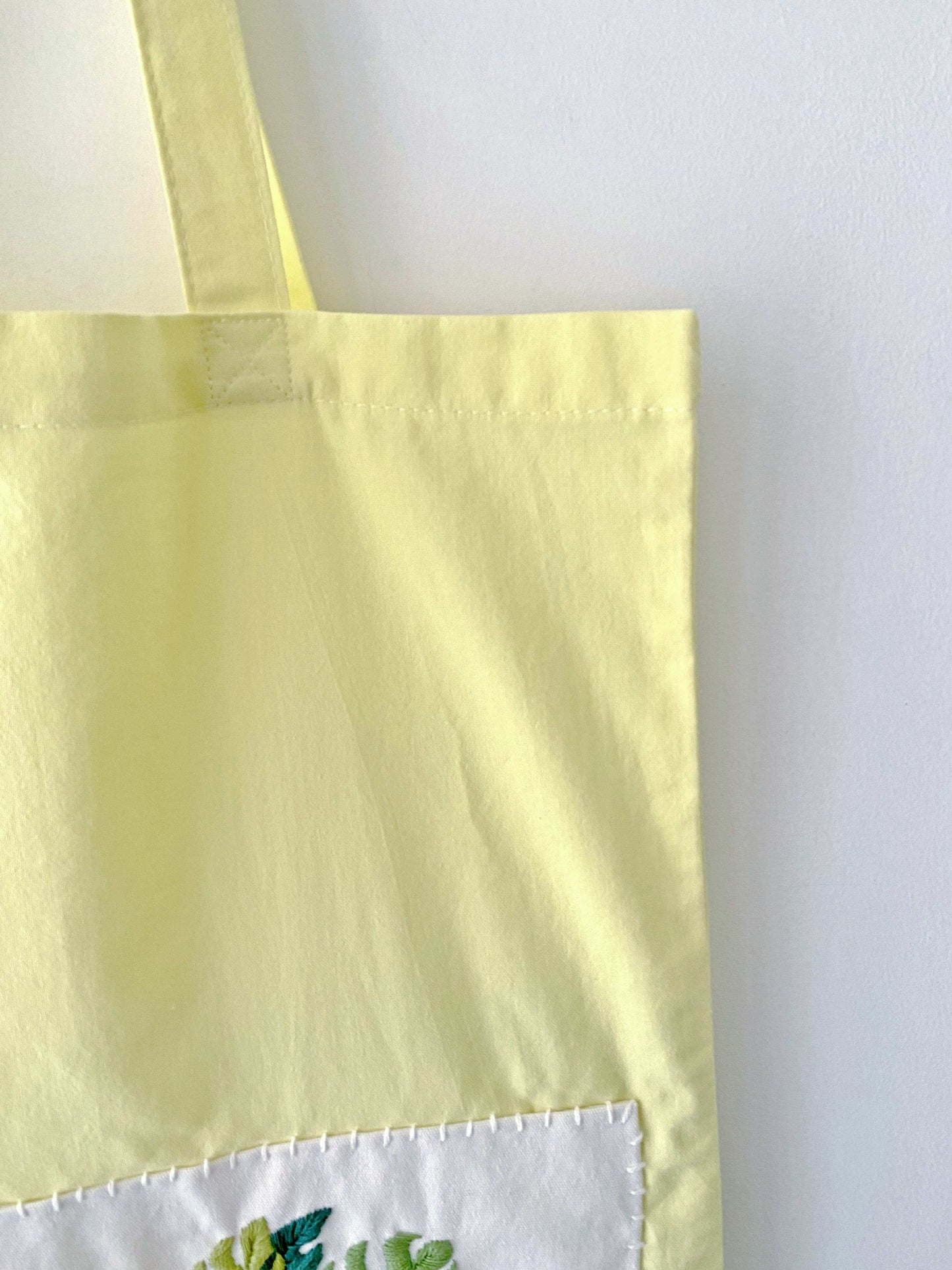 handmade embroidery tote bag symbolizing green and mindful living