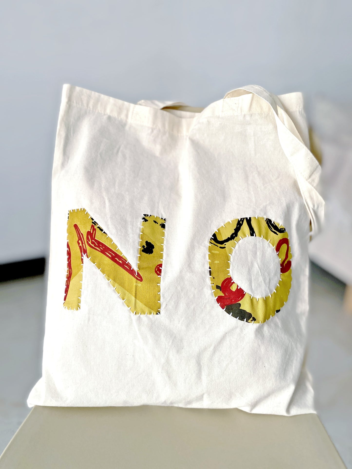 Lightweight eco tote bag with artisanal hand-sewn patchwork for daily essentials
