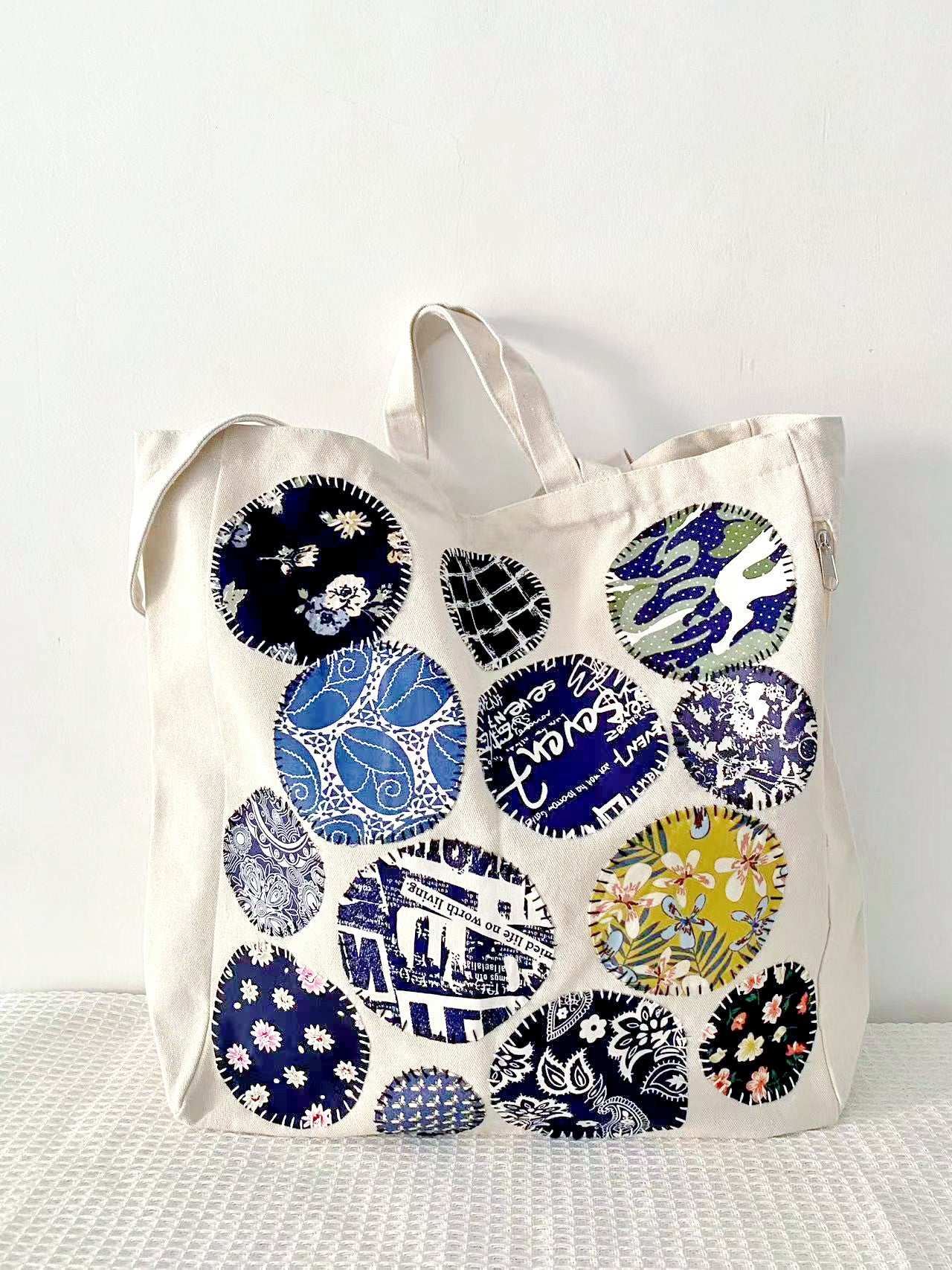 Natural material tote for ladies, featuring custom stitched patterns ideal for artistic fashion lovers