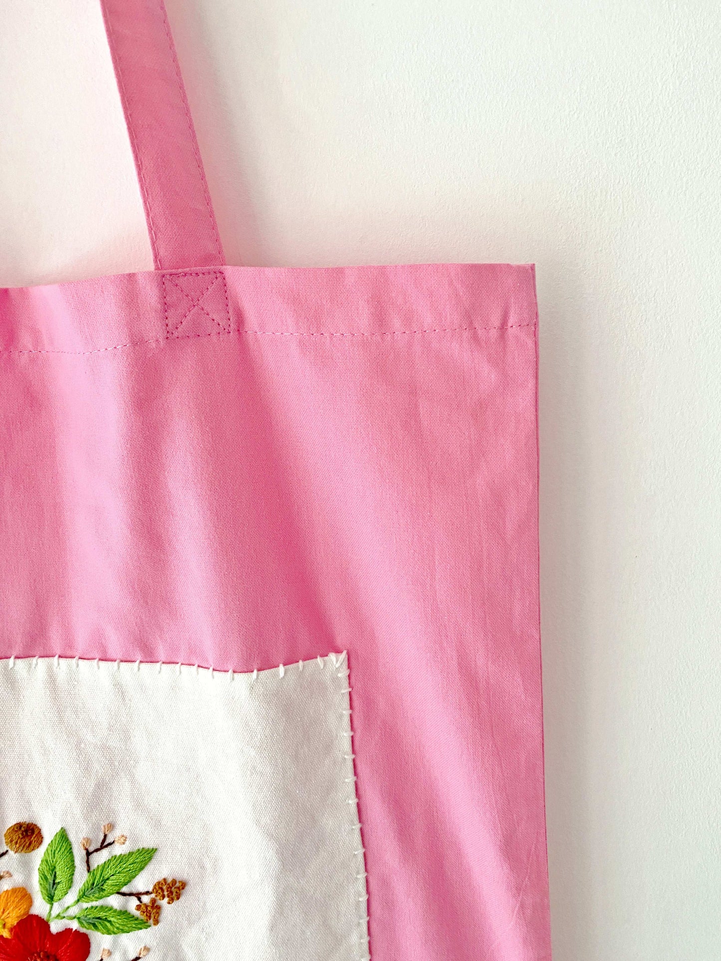Sustainable magenta tote with stitched flowers