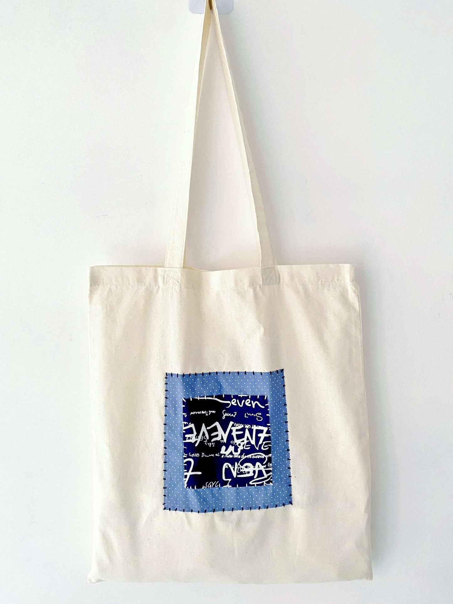 Spacious bag featuring hand-sewn patchwork, blending durability and relaxed elegance