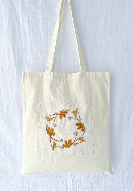 eco-friendly shoulder bag with hand embroidered whimsical art