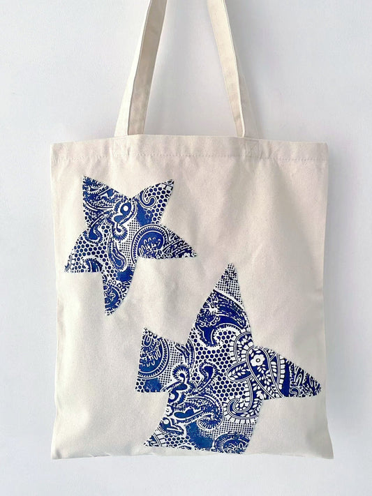 Eco-friendly hand-embroidered cotton tote bag with artistic floral design
