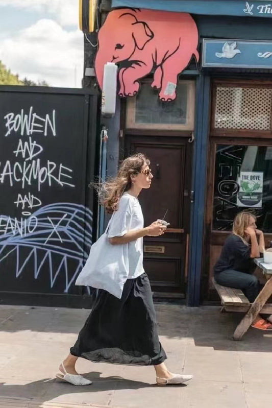 Quilted patchwork shoulder bag showing detailed stitching and fabric patterns