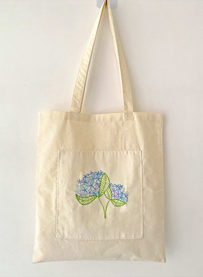Organic cotton canvas tote with handcrafted floral details for stylish women
