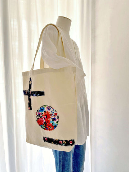 Unique handcrafted tote bag with artistic fabric patterns and minimalist design