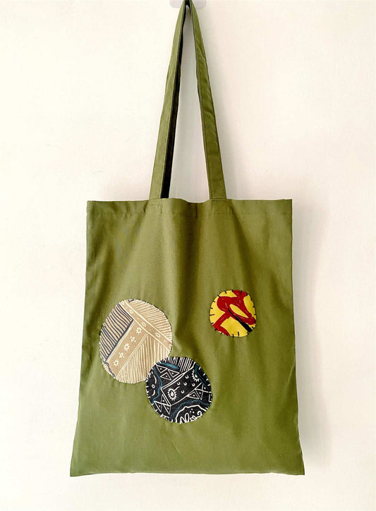 Handmade organic cotton tote bag with unique patchwork design