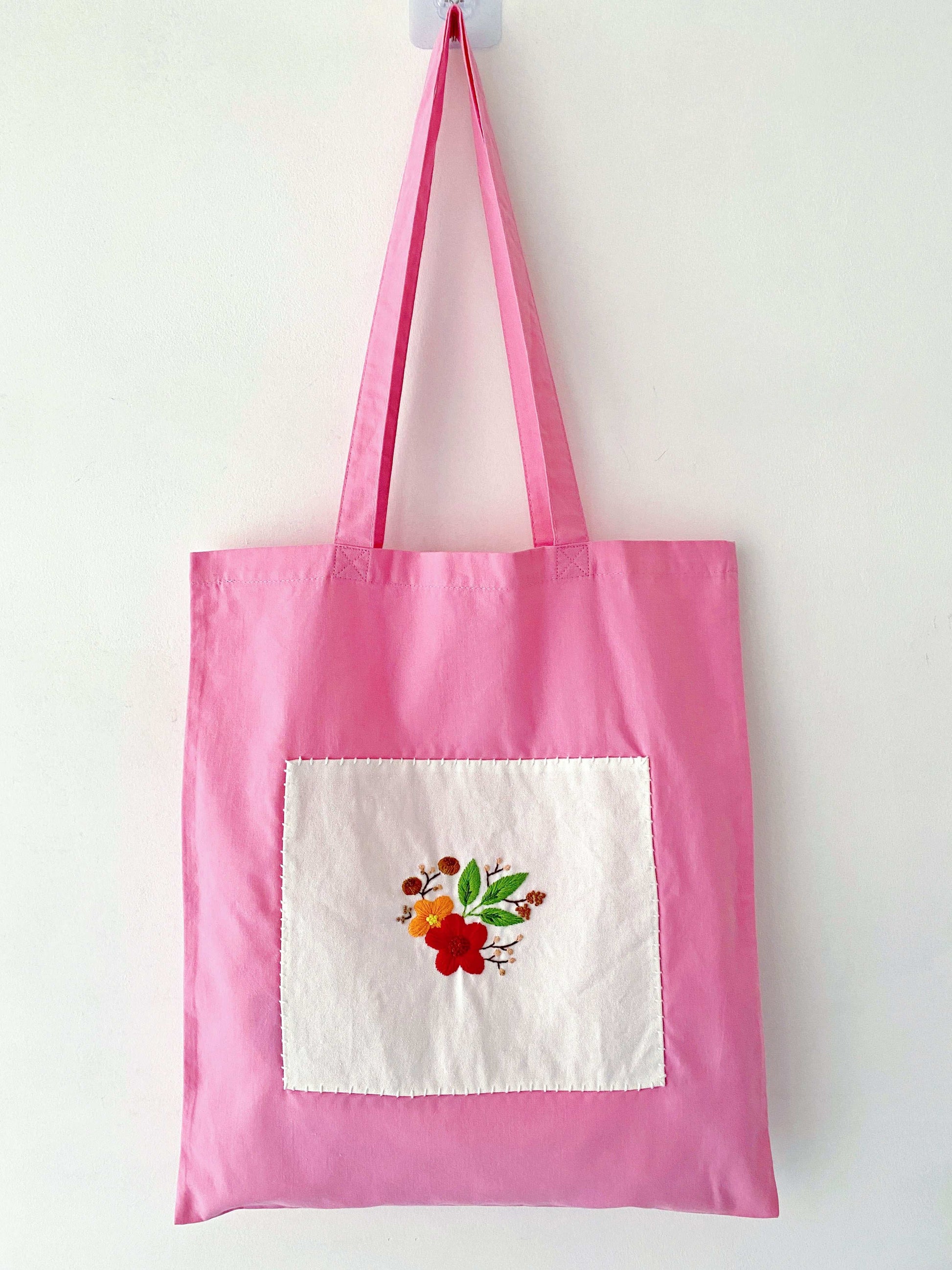Soft lightweight shoulder bag featuring artistic flower embroidery
