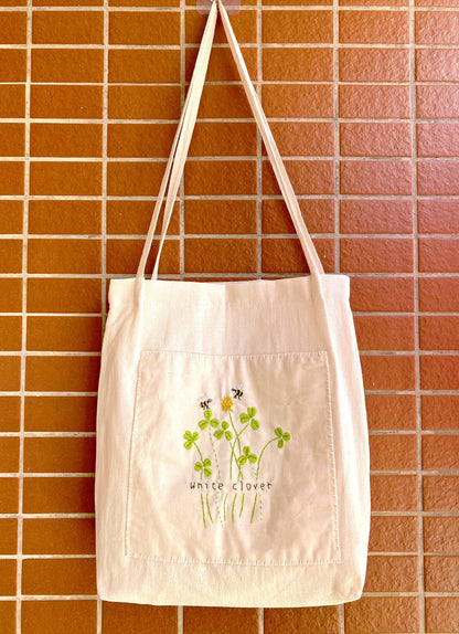 Luxury handmade linen purse with embroidered botanical patterns