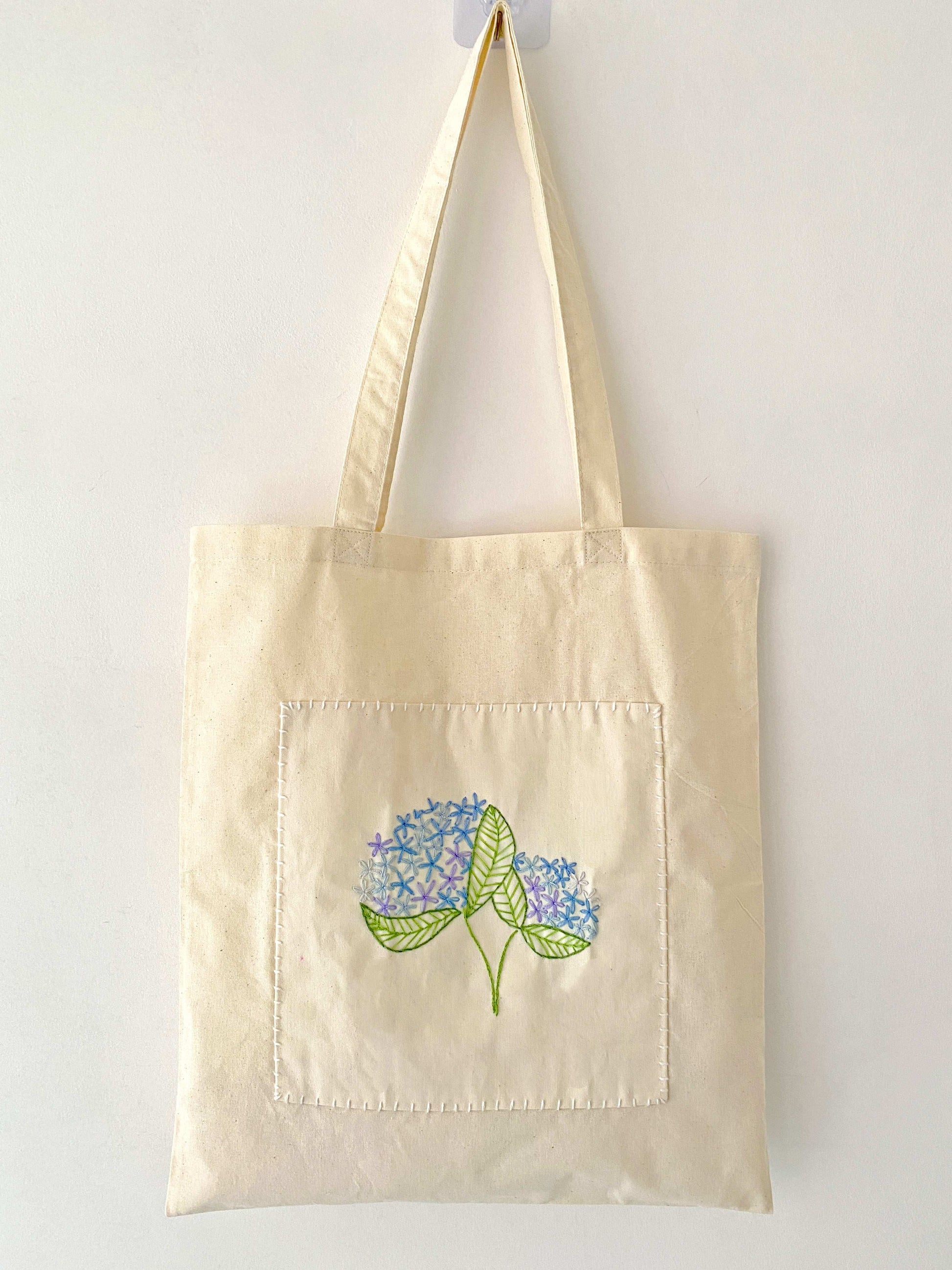 Eco-chic handmade shoulder bag with botanical embroidery for gift ideas