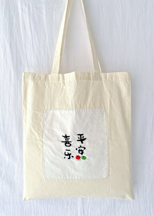 relaxed style women’s tote with hand stitched flower details