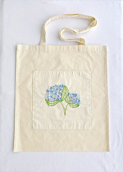 minimal style cotton handbag with delicate embroidered flowers