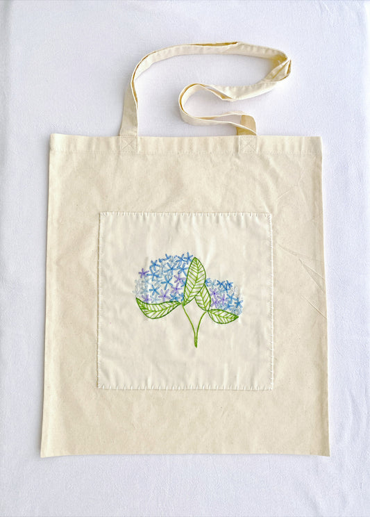 minimal style cotton handbag with delicate embroidered flowers