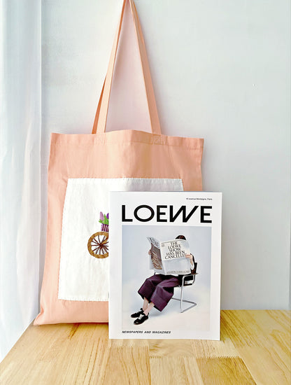 eco-friendly cotton tote bag with hand-embroidered bicycle and floral design