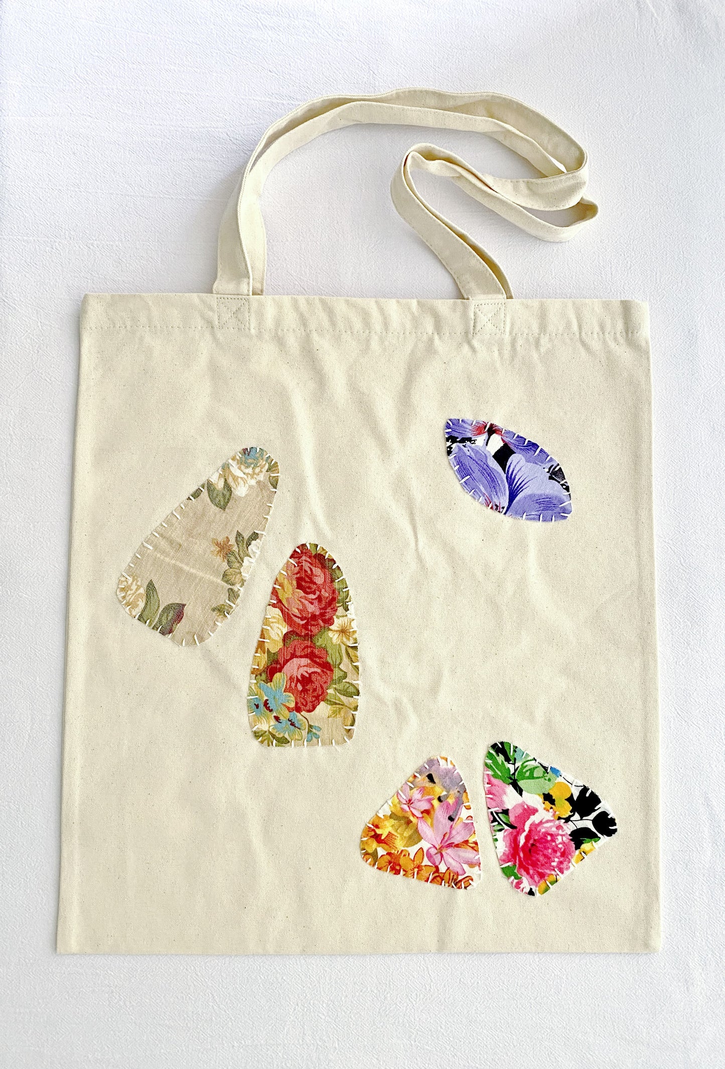 sustainable women’s canvas tote with hand-crafted patchwork design accents